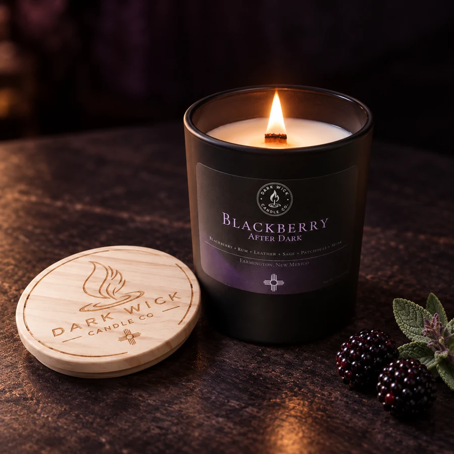 Dark Wick Blackberry After Dark candle, lit beside its wooden lid